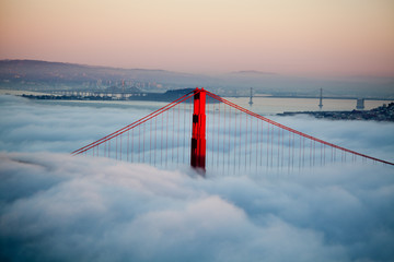 Thick fog covering Golden Gate Bridge.