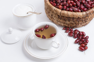 tea from rosehip on a white background