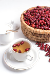 tea from rosehip on a white background