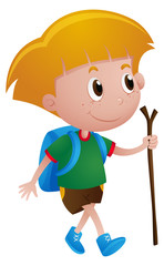 Boy with backpack and walking stick