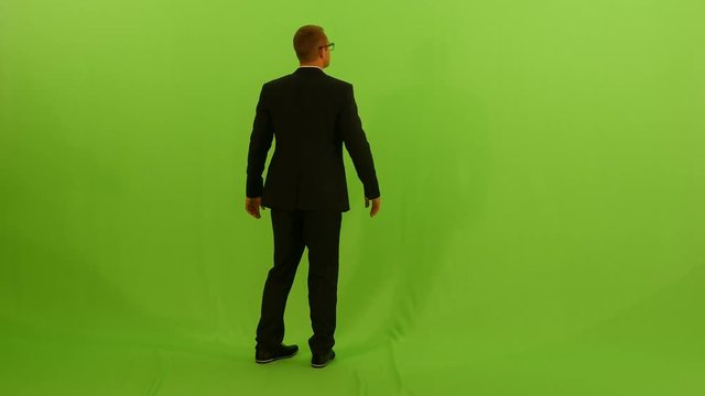 young business professional isolated against green screen background.