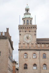 Fototapeta na wymiar Clock Tower Building; Piazza Maggiore Square; Bologna