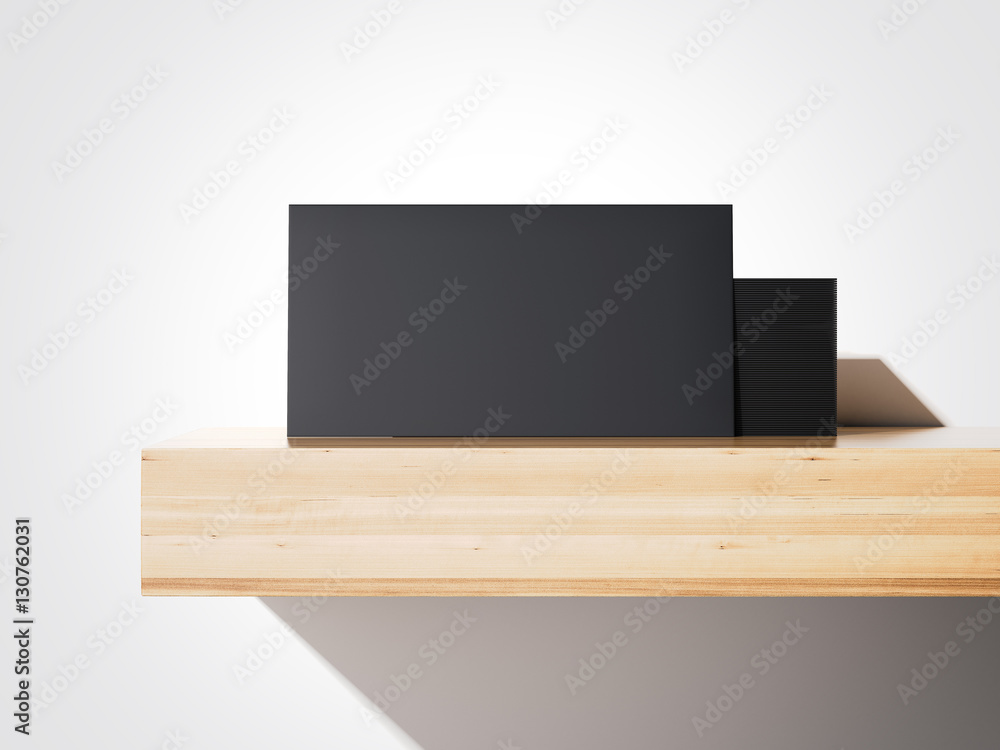 Poster stack of black business cards on a shelf. 3d rendering