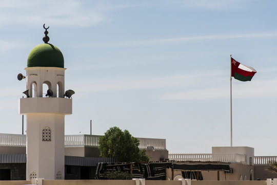 Mosque tower ubar Dhofar mountain region Oman flag salalah 2