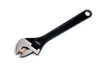 adjustable wrench and nut on white background