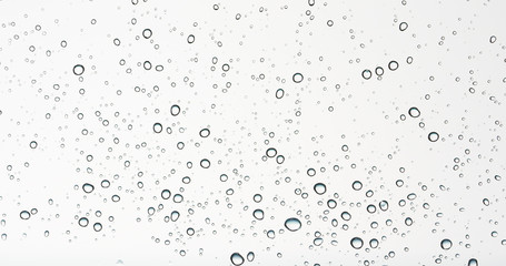 Fototapeta na wymiar clean round water drops on transparent glass