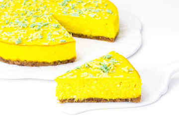 Delicious bright orange homemade american pumpkin pie on a white