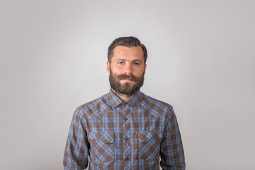 portrait of a young man with a beard and mustache