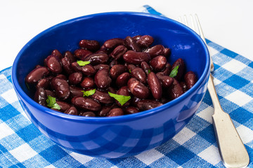 Red beans in blue salad bowl