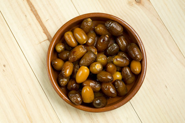 Dates in a clay pot.