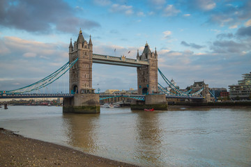 Fototapeta na wymiar Dull autumn day in London. Quay of the river Thames in London near Tower Bridge. 