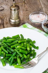 Salad of green beans on white plate