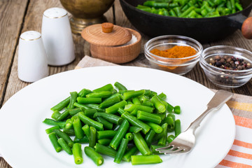 Salad of green beans on white plate