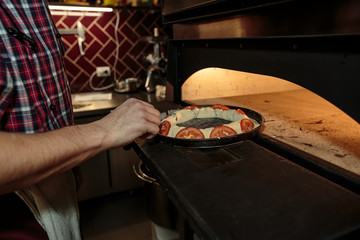 Chef making a pizza