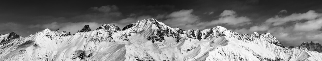 Large panoramic view on snowy mountains in sunny day - obrazy, fototapety, plakaty