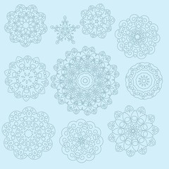 Snowflakes on light blue background for Your design. Winter patt