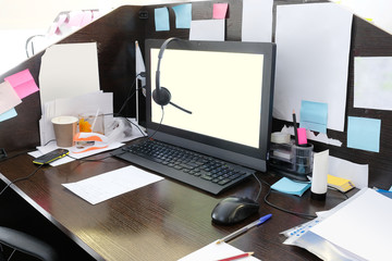 office table with PC and different stationery on it