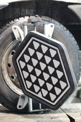 Close up target of wheel alignment equipment on a car's wheel