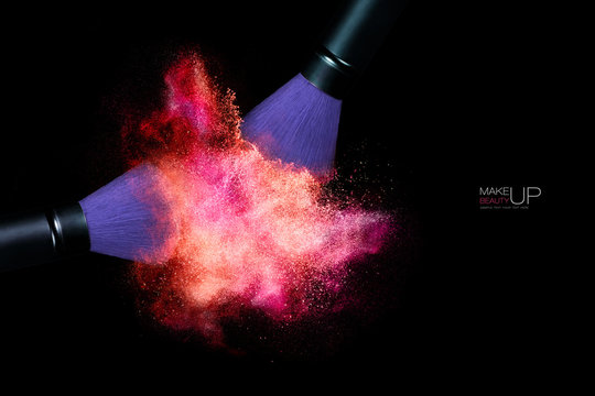 Color Explosion with Makeup Brushes Applying Powder. Isolated on