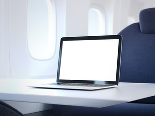 Fototapeta premium Laptop on the table in airplane cabin. 3d rendering
