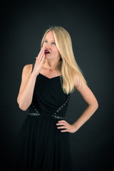 Fototapeta premium Beautiful woman doing different expressions in different sets of clothes: yawn