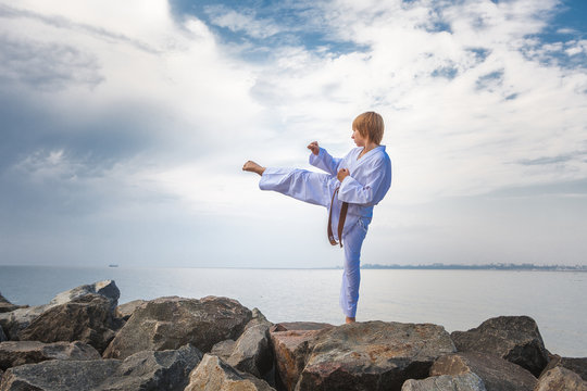 Young boy training karate