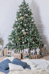 Beautifully decorated Christmas tree with presents.