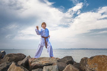 Young boy training karate