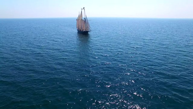 Tall ship at sea, majestic vessel sailing in open waters in good weather.
