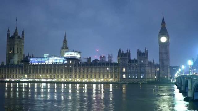 London in the mist - Houses of Parliament and Big Ben Westminster by night - time lapse shot
