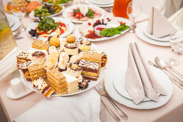 Dessert table with cake and candy on a wedding day