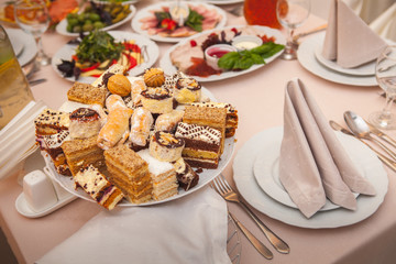 Dessert table with cake and candy on a wedding day