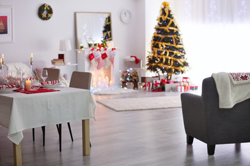 Table served for Christmas dinner in living room