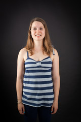 Beautiful woman doing different expressions in different sets of clothes: smile