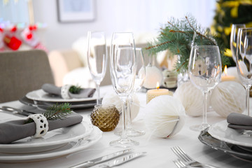 Table served for Christmas dinner in living room, close up view