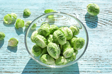 Brussels sprouts in glass bowl on table