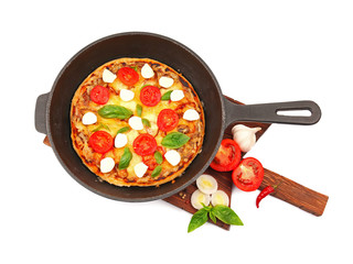 Freshly baked pizza in a pan on white background