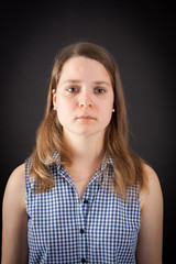 Beautiful woman doing different expressions in different sets of clothes: sad