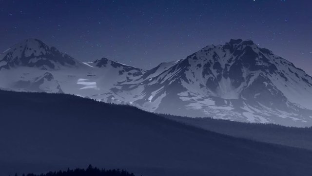Starry sky and clouds slip past majestic mountains, time lapse.
