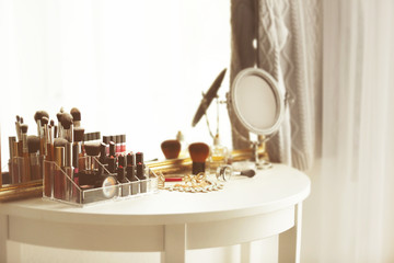 Cosmetics on table in room interior