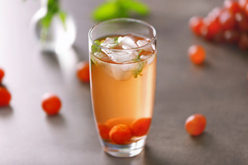 Cold grape cocktail on grey background