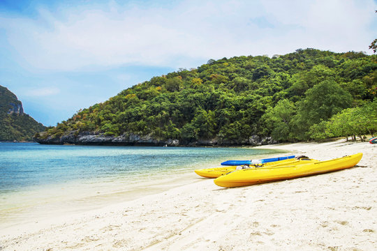 White sand beach with kayak boat at island sea landscape