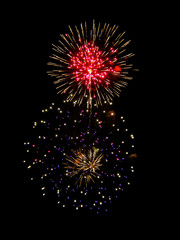 Brightly Colorful Fireworks isolated black background. New Year celebration fireworks.