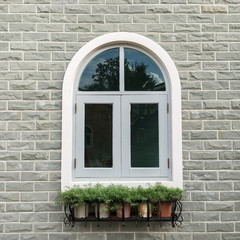 European style window with brick wall background