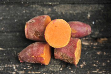 sweet potato on wooden background