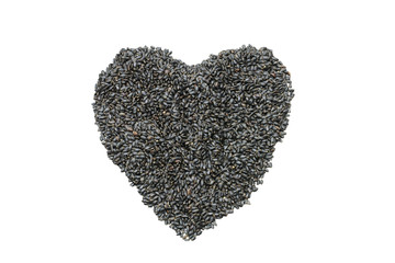 Dried hairy basil seeds in heart shape on white background