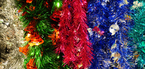 Multicolor shiny Christmas garland background. Festive tinsel