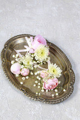 Fototapeta na wymiar Wedding boutonniere with pink rose, ranunculus and white chrysan