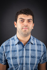 Handsome man doing different expressions in different sets of clothes: thinking