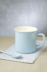 Blue mug and spoon